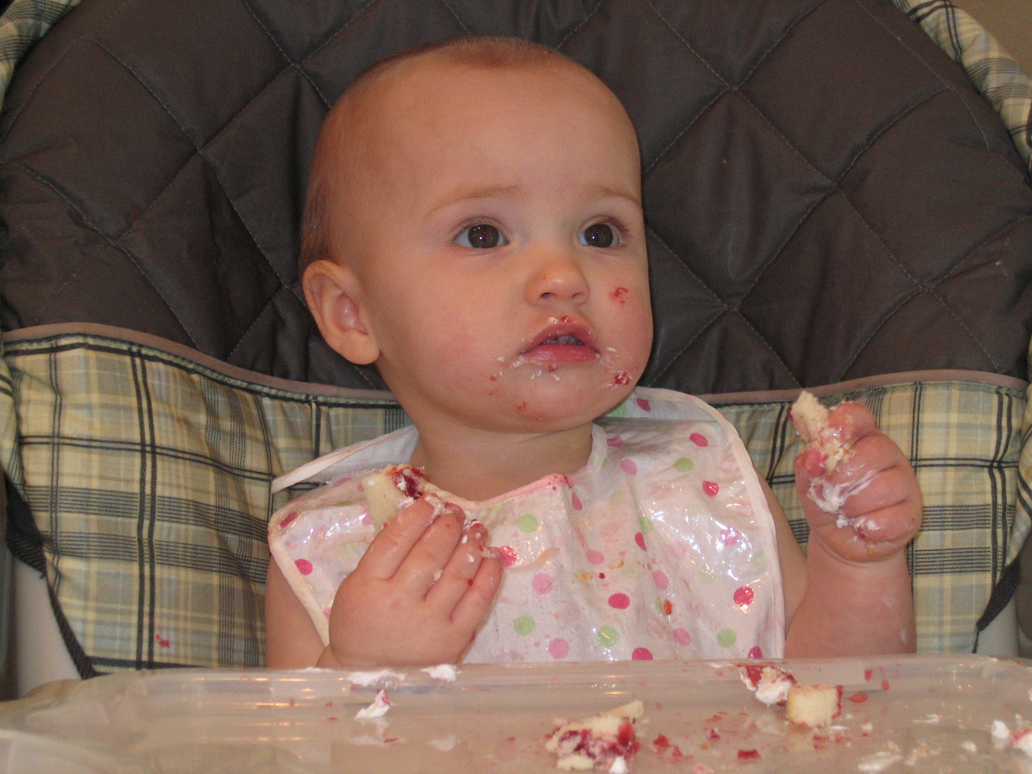 Megans1stbday/18__Megan_eating_birthday_cake.jpg